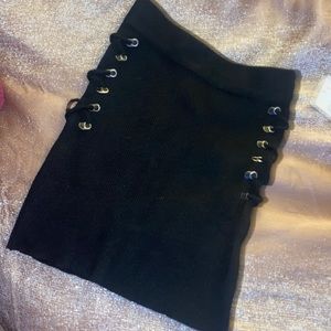 Super cute bodycon black skirt with illusion lace up on the sides